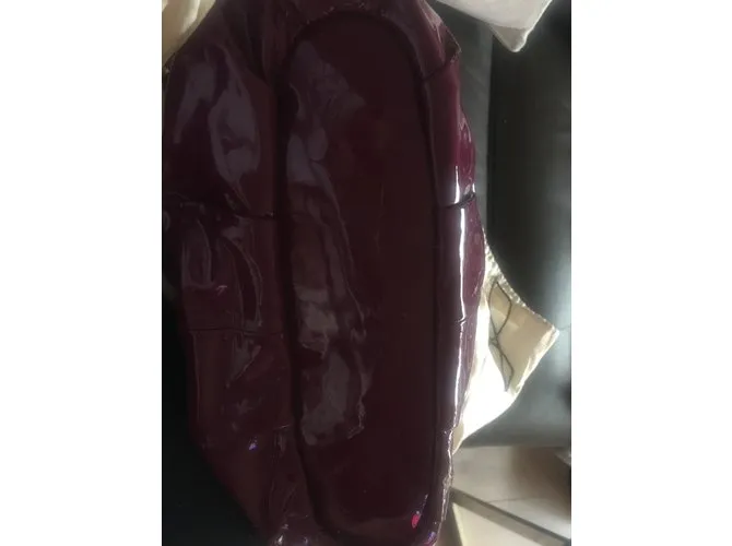 Coach Bolsos de mano Ciruela 