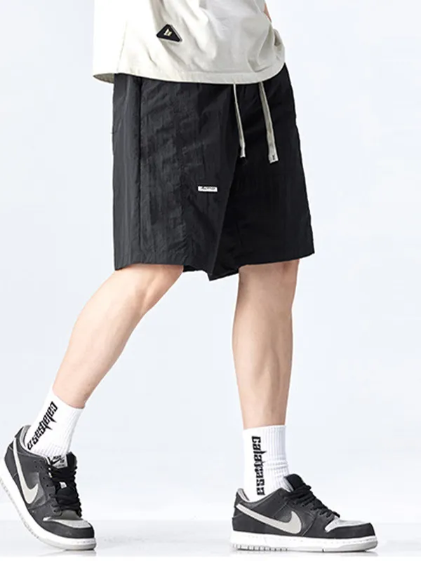 Pantalones cortos deportivos sueltos de secado rápido para hombre