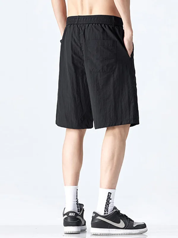 Pantalones cortos deportivos sueltos de secado rápido para hombre