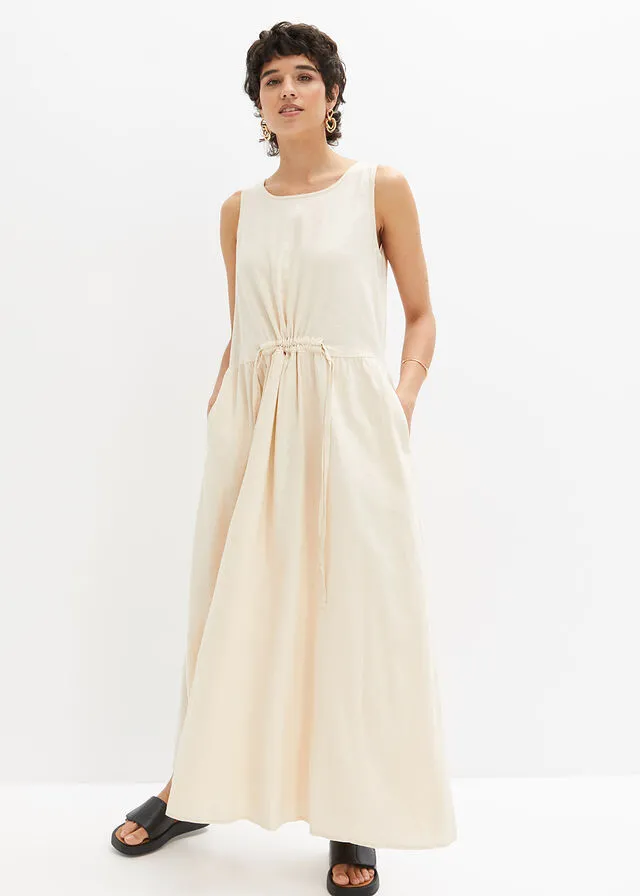 VESTIDO LARGO DE MALLA CON LINO Y PASACORDóN EN LA CINTURA BEIGEARENA